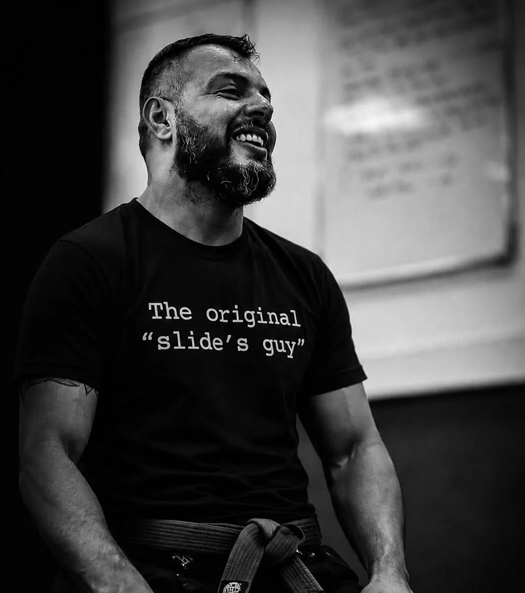 Raphael Saib coaching on the mats